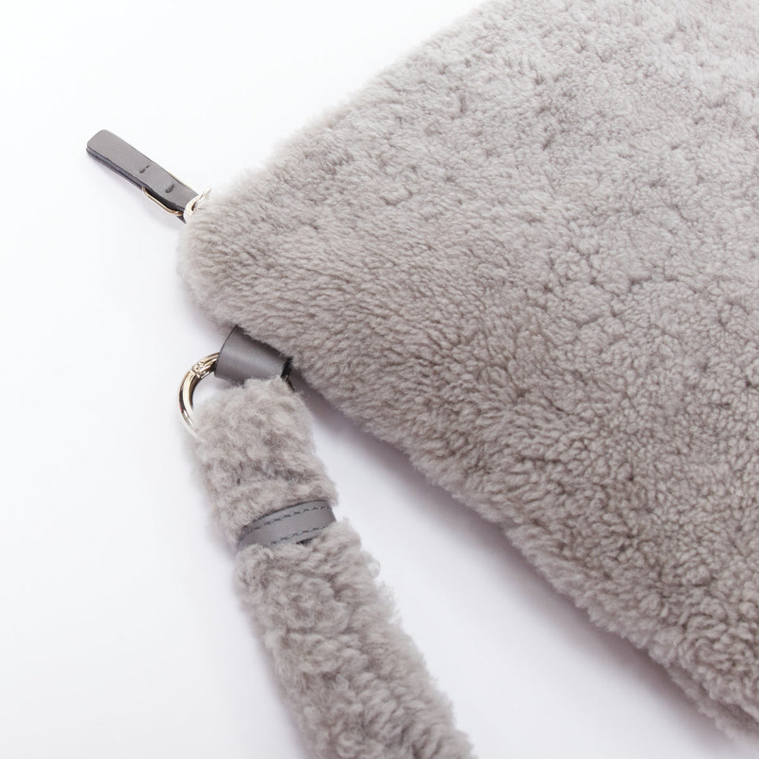 ERMENEGILDO ZEGNA grey lambskin shearling wrist strap zip clutch bag
