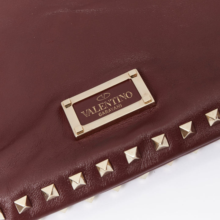 VALENTINO Rockstud rose gold burgundy leather studded logo clutch