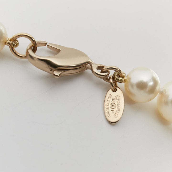 CHANEL 08P black Camelia enamel station faux pearl CC long necklace