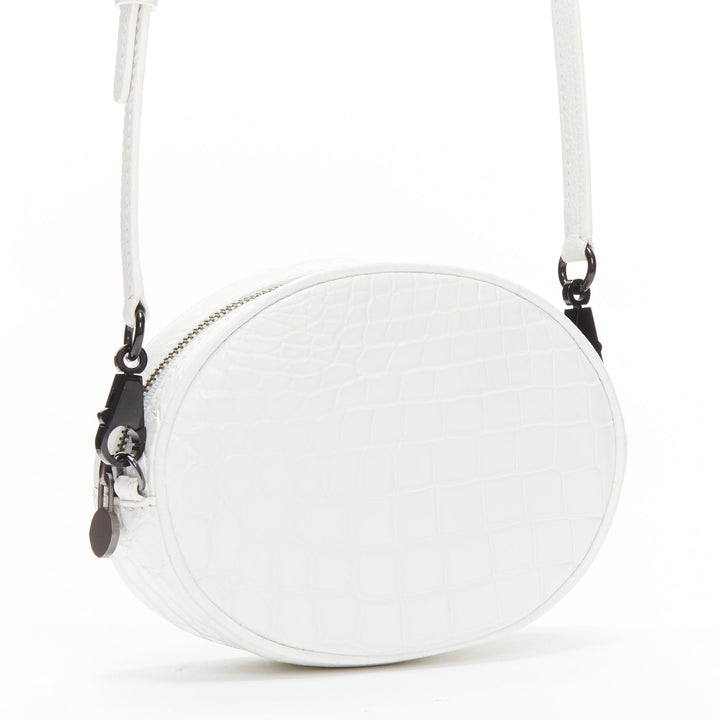 FERIDA YANG Emma white matte scaled leather oval crossbody belt bag