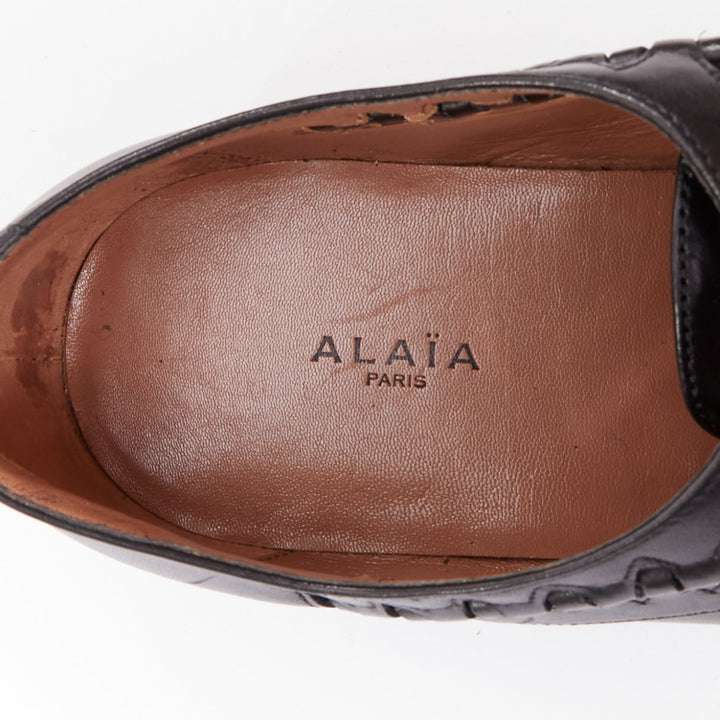 ALAIA Goodyear black leather laser cut out braided brogue EU38