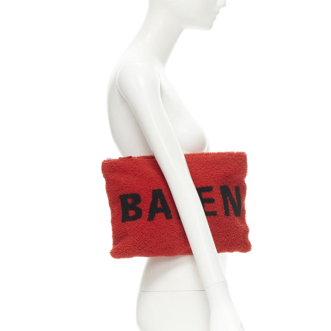 BALENCIAGA Demna logo red black dyed merino lamb shearling zip clutch bag