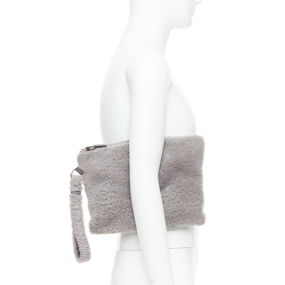 ERMENEGILDO ZEGNA grey lambskin shearling wrist strap zip clutch bag