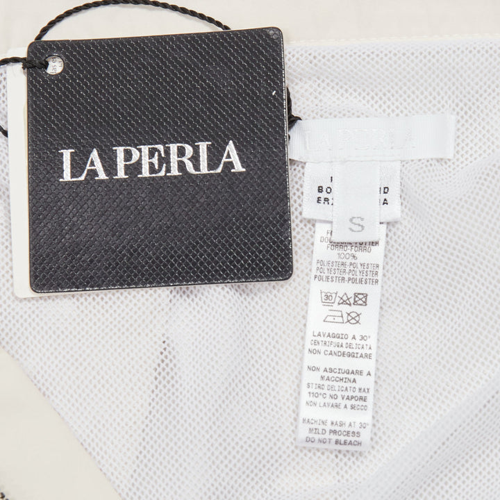 LA PERLA cream nylon silver buckle waist mesh lined safari shorts S