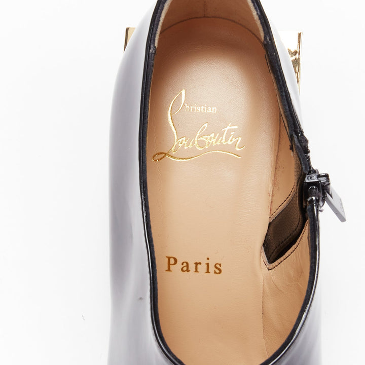 CHRISTIAN LOUBOUTIN Xilobooties 55 gold pyramid heel black patent pump EU38