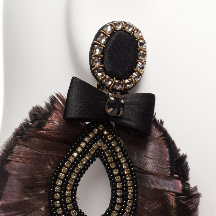 RANJANA KHAN black holographic feather crystal bow dangling clip earrings Pair