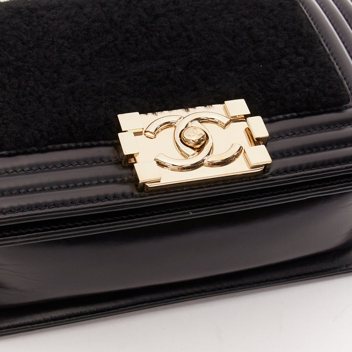 CHANEL Boy Small black shearling leather gold CC push lock chain flap bag