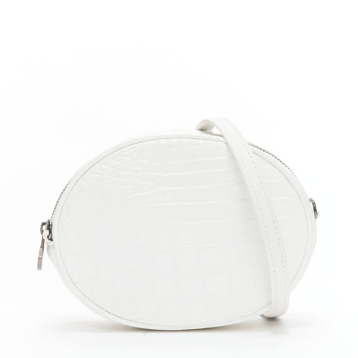 FERIDA YANG Emma white matte scaled leather oval crossbody belt bag