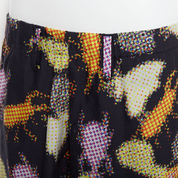 ISSEY MIYAKE MEN multicolour abstract print asymmetric harem pants