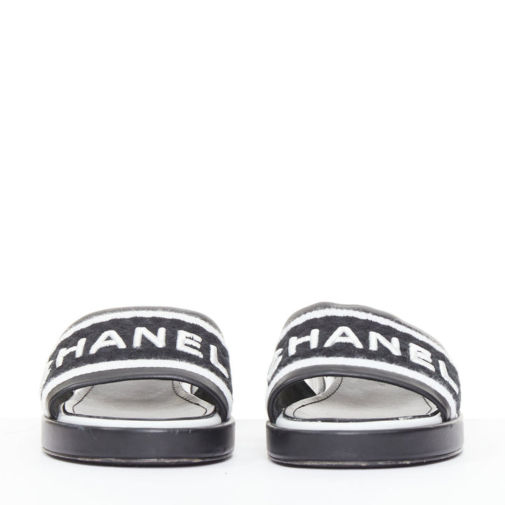 CHANEL 2021 Runway black white logo embroidered lambskin CC mule sandals EU35.5