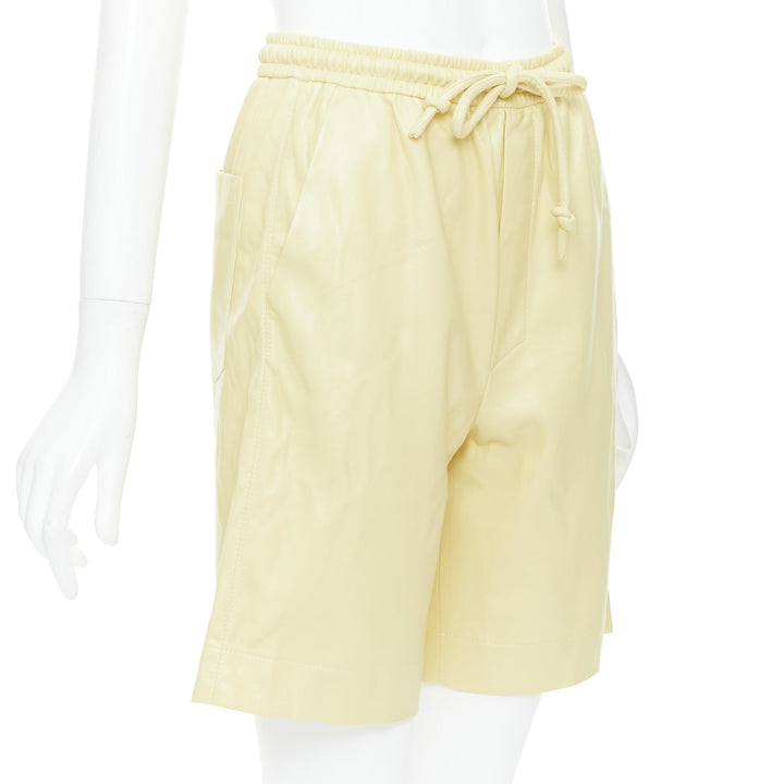 NANUSHKA  Munira Okobor butter yellow vegan leather drawstring bermuda shorts XS