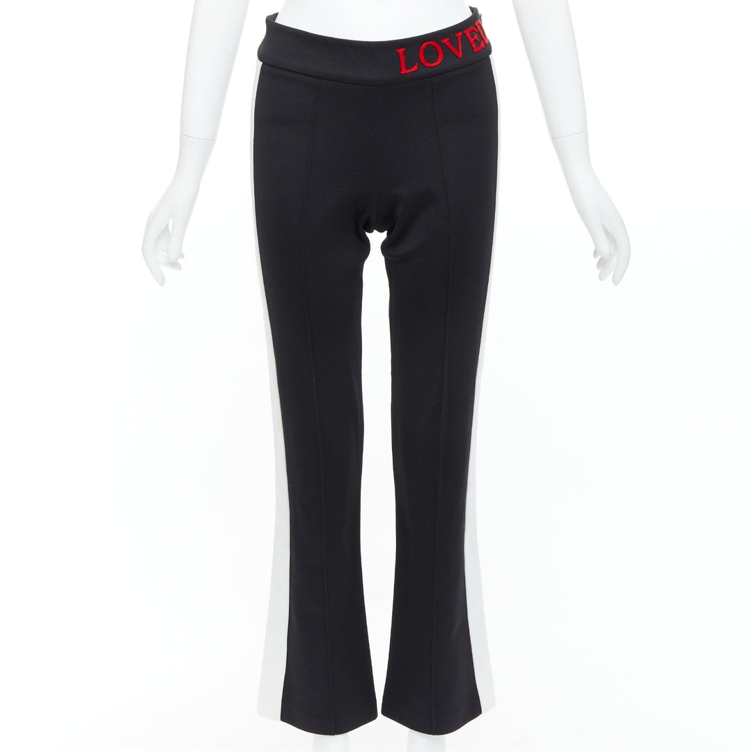 GUCCI LOVED red embroidered black piped flare track pants