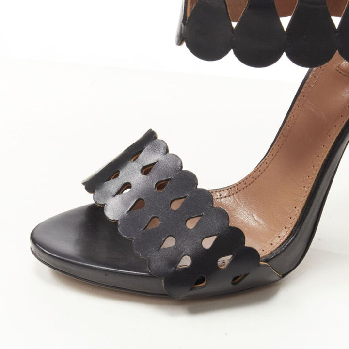 Female mannequin wearing Alaia by Azzedine Alaia Black Leather Women Heels in Size EU38 | Available at JHROP