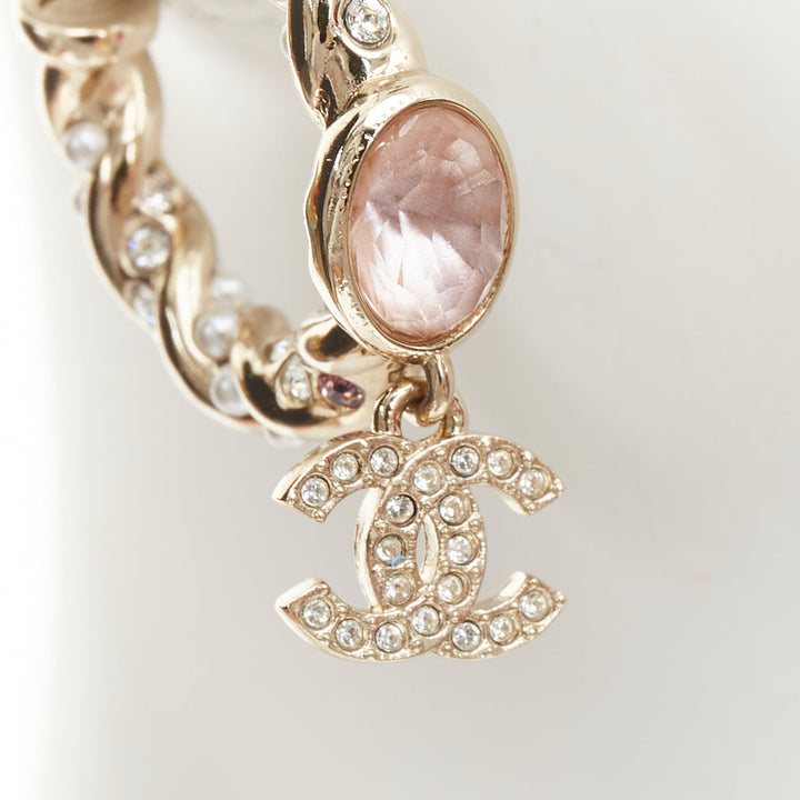 CHANEL 2023 Runway pink stone twisted chain CC crystal rhinestone hoop earrings