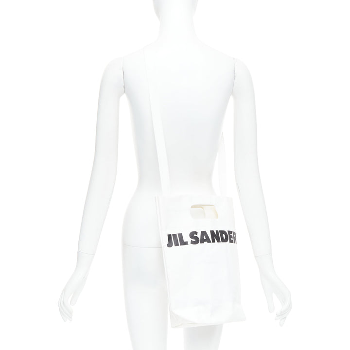 JIL SANDER cream black laminated paper logo crossbody tote bag