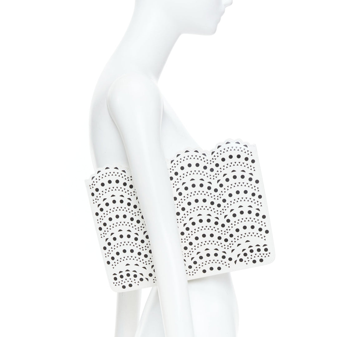 ALAIA Vienne laser cut white leather black lined scalloped zip pouch clutch bag