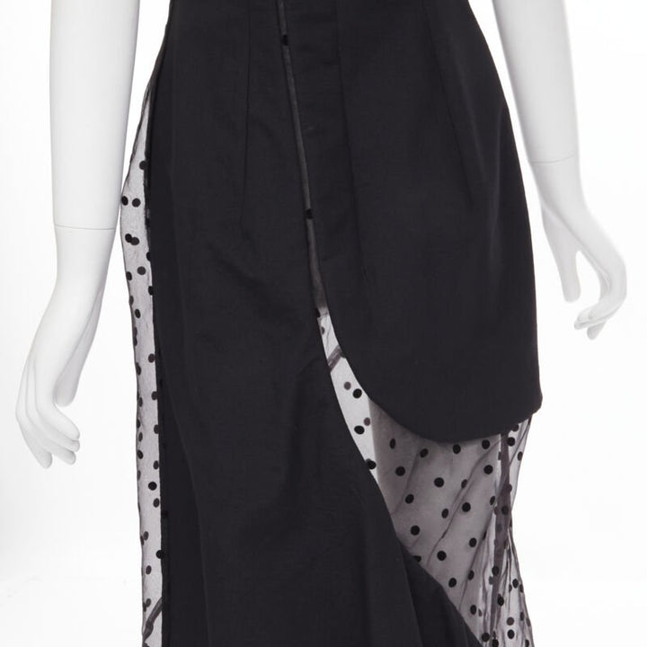 Female mannequin wearing Comme Des Garcons by Rei Kawakubo 1997 Runway Black Wool Women Cocktail Dresses in Size  M | Available at JHROP