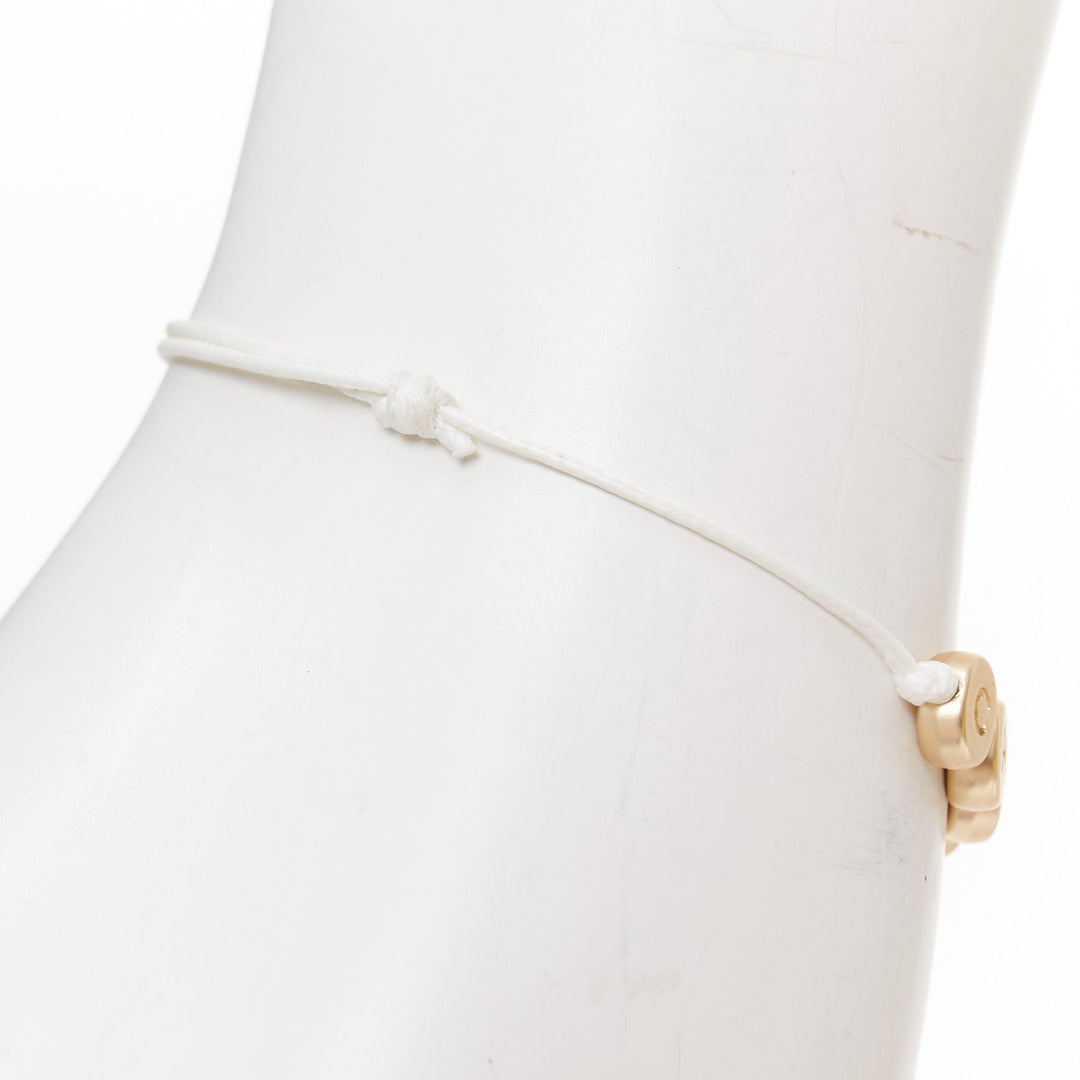 CHANEL white gold tone logo letter bead charm white thread lucky bracelet