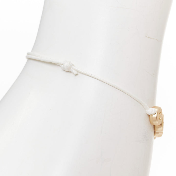 CHANEL white gold tone logo letter bead charm white thread lucky bracelet