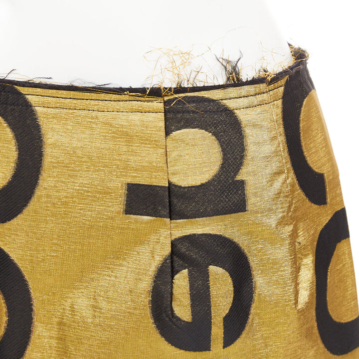 COMME DES GARCONS 2020 Runway gold black polyester silk logo cut out shorts M