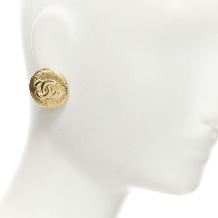 CHANEL Vintage CC logo gold starburst textured clip on earrings