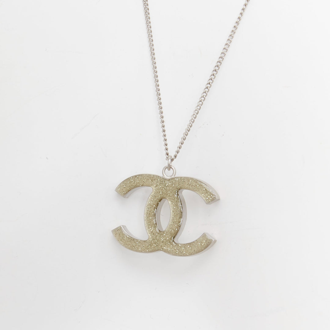 CHANEL 09A silver toned green resin reversible crystal pave CC pendent necklace