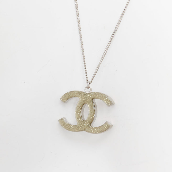 CHANEL 09A silver toned green resin reversible crystal pave CC pendent necklace