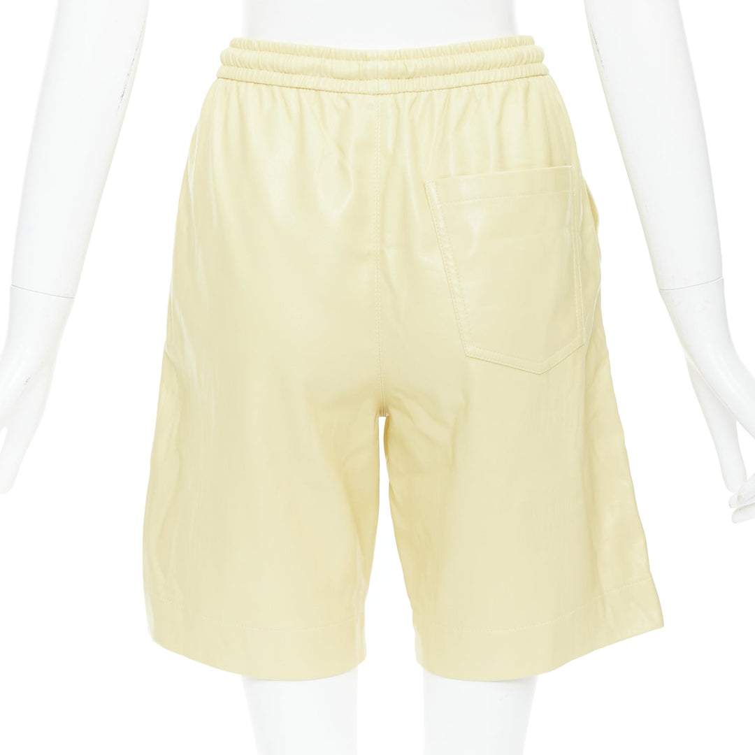 NANUSHKA  Munira Okobor butter yellow vegan leather drawstring bermuda shorts XS