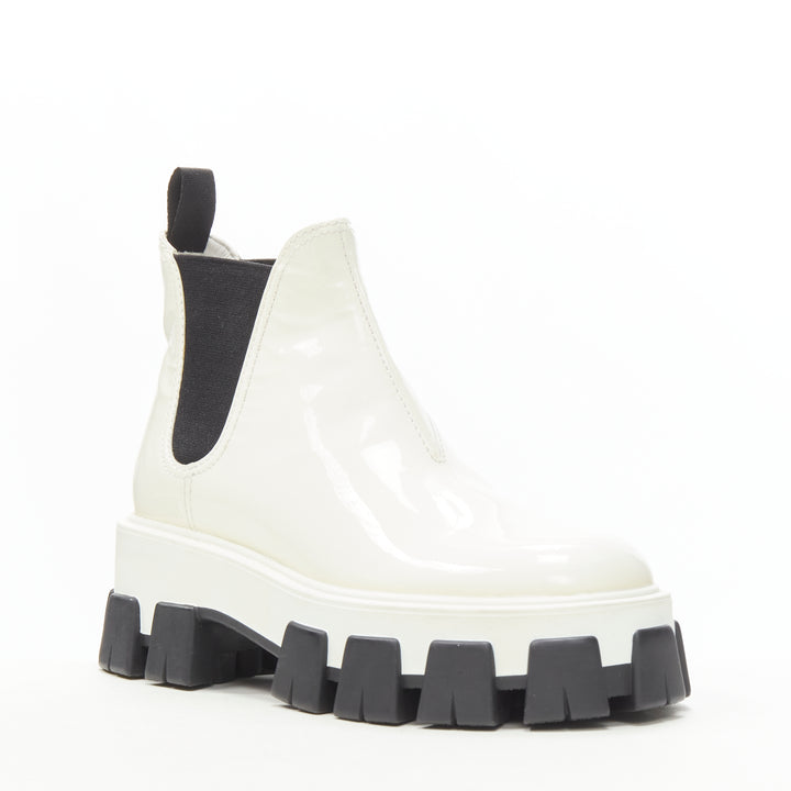 Female mannequin wearing Prada by Miuccia Prada Fall Winter 2019 White Patent Leather Women Boots in Size EU36 | Available at JHROP