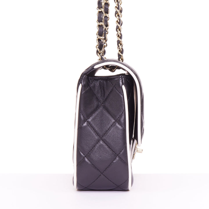 CHANEL 2025 Graphic Frame black quilted lambskin piping mini square flap bag