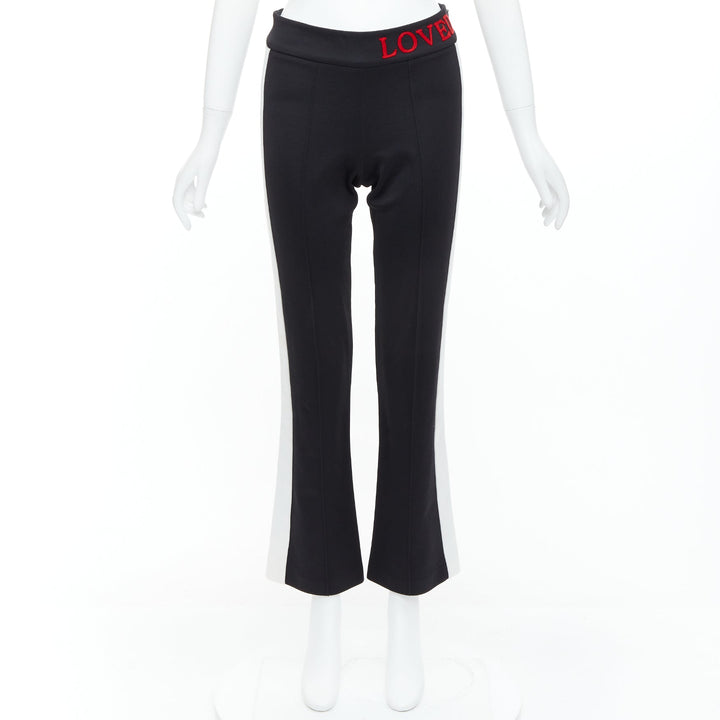 GUCCI LOVED red embroidered black piped flare track pants