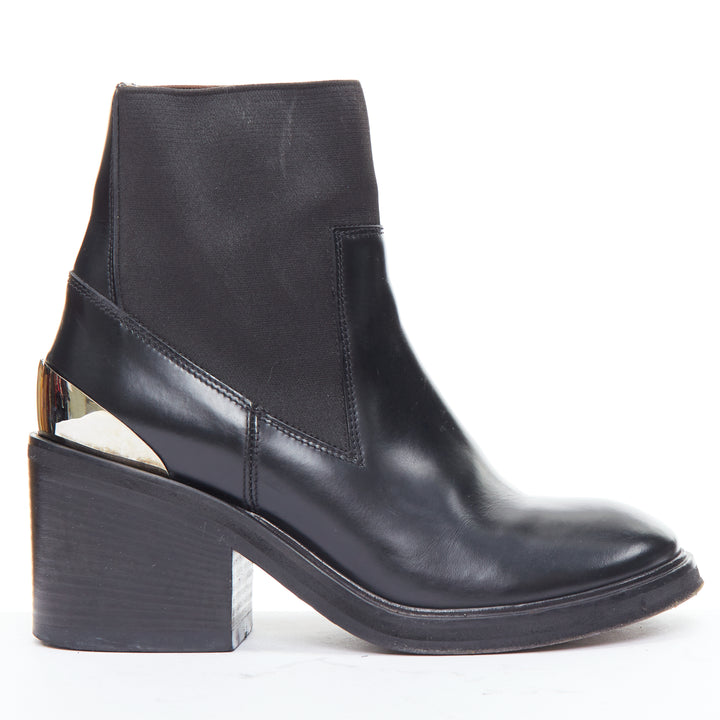 Female mannequin wearing Acne Studios Dion Black Leather Women Boots in Size EU38 | Available at JHROP