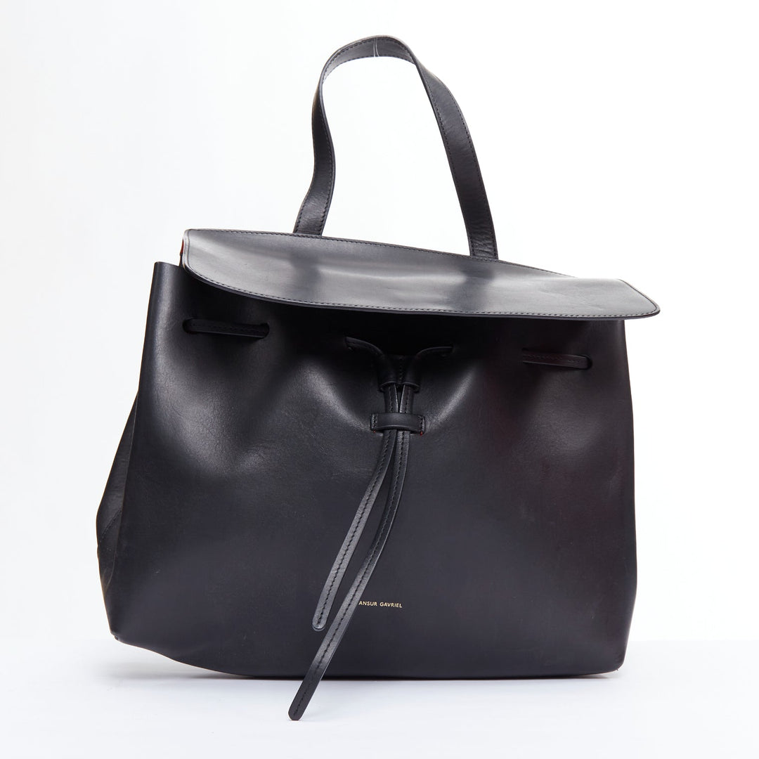 Female mannequin wearing Mansur Gavriel Lady Black Leather Women Bag in Size  | Available at JHROP