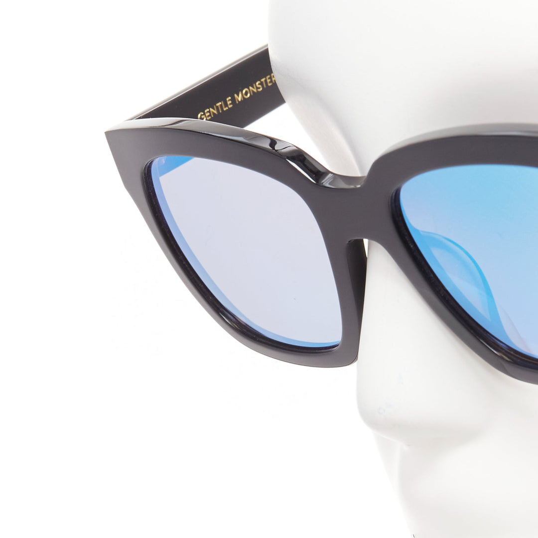 GENTLE MONSTER The Dreamer black frame reflective blue lens oversized sunglasses
