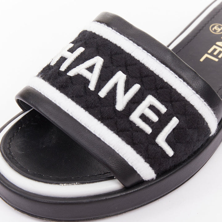CHANEL 2021 Runway black white logo embroidered lambskin CC mule sandals EU35.5
