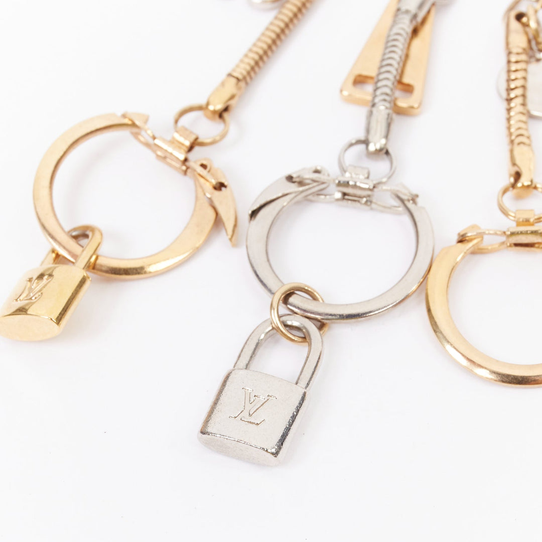 LOUIS VUITTON palladium gold plated pin LV lock heart flower keyring bag charm