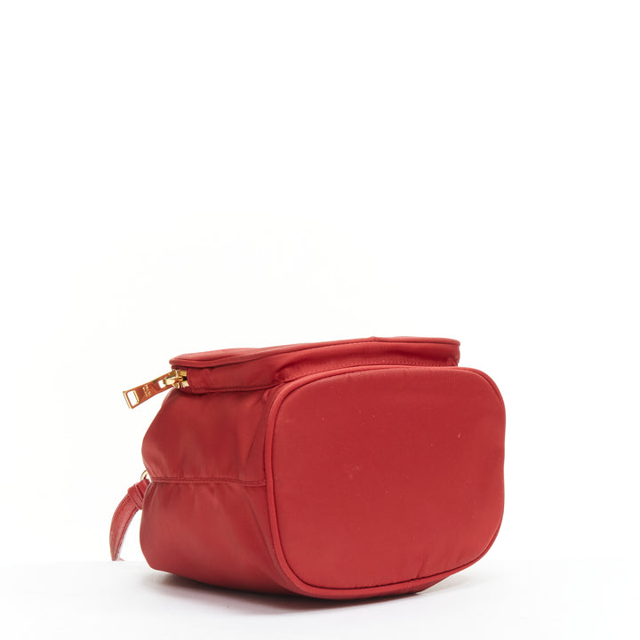 Female mannequin wearing Prada by Miuccia Prada Red Nylon Women Bag in Size  | Available at JHROP