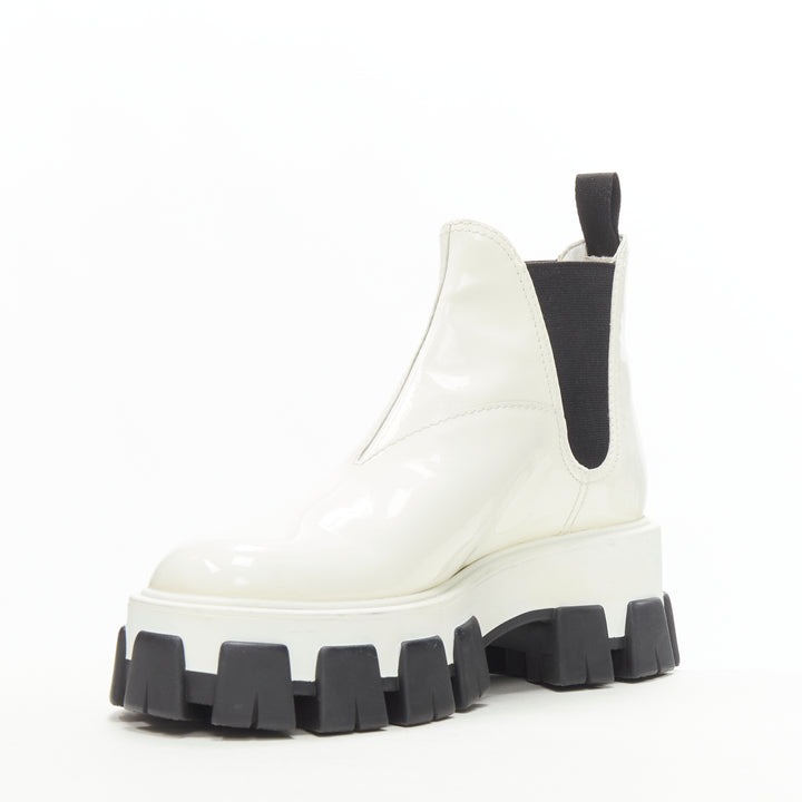 Female mannequin wearing Prada by Miuccia Prada Fall Winter 2019 White Patent Leather Women Boots in Size EU36 | Available at JHROP