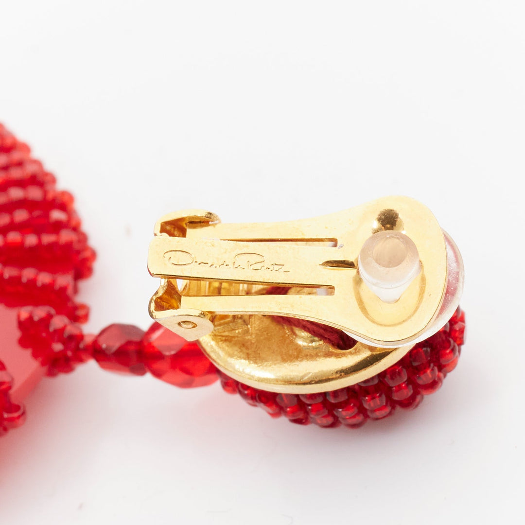 OSCAR DE LA RENTA red beaded acrylic spiral shell dangling clip on earrings pair