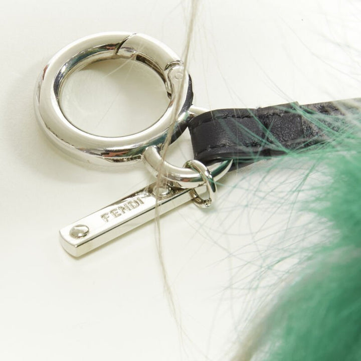  mannequin wearing Fendi Monster Bug Green Fur Key Chain in Size  | Available at JHROP