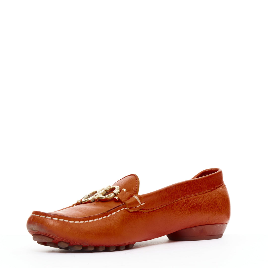 SALVATORE FERRAGAMO burnt orange leather gold logo buckle loafers 6.5