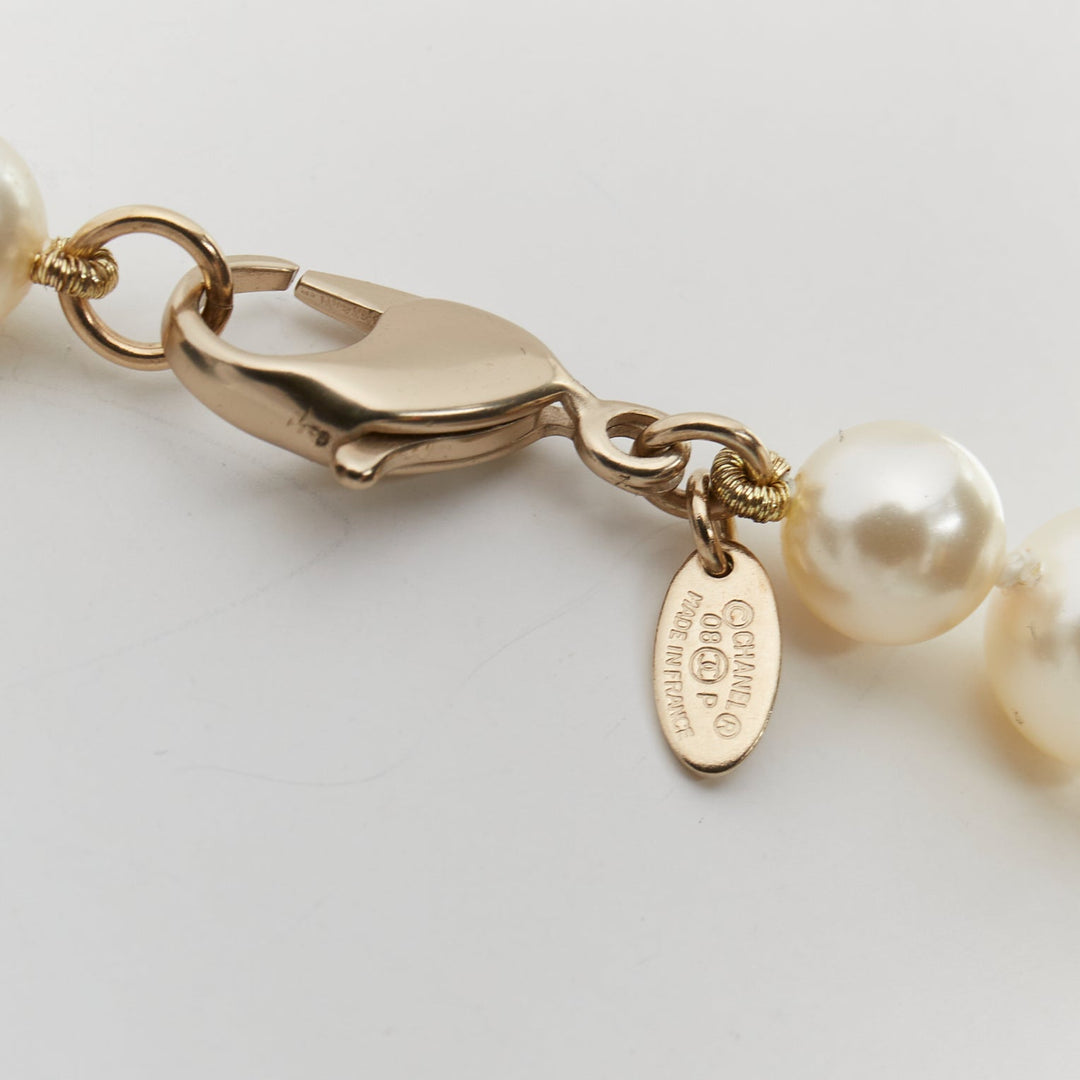 CHANEL 08P black Camelia enamel station faux pearl CC long necklace