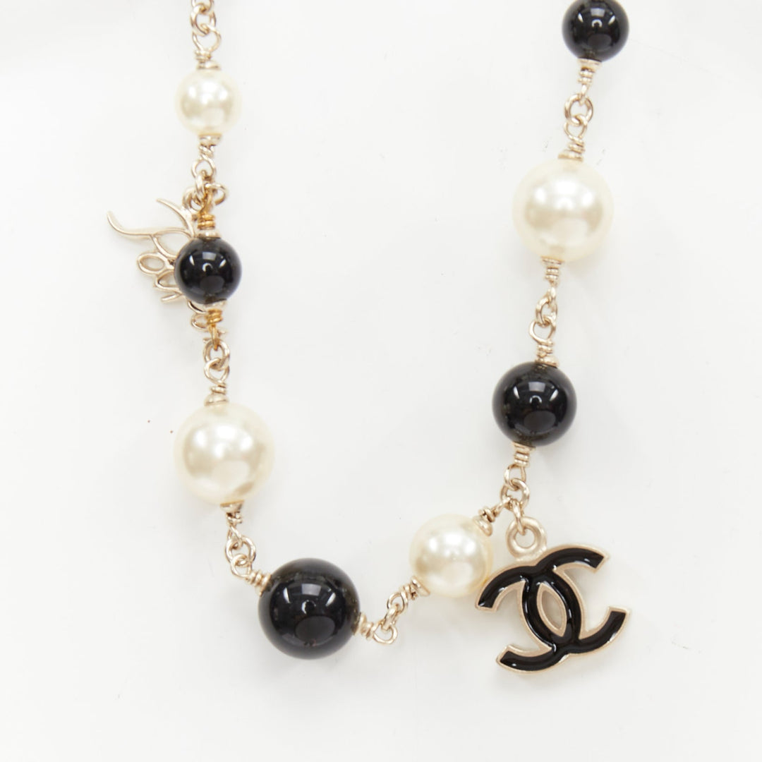 CHANEL 10C Runway CC Logo Faux Pearl Sautoir coco figurine charm necklace