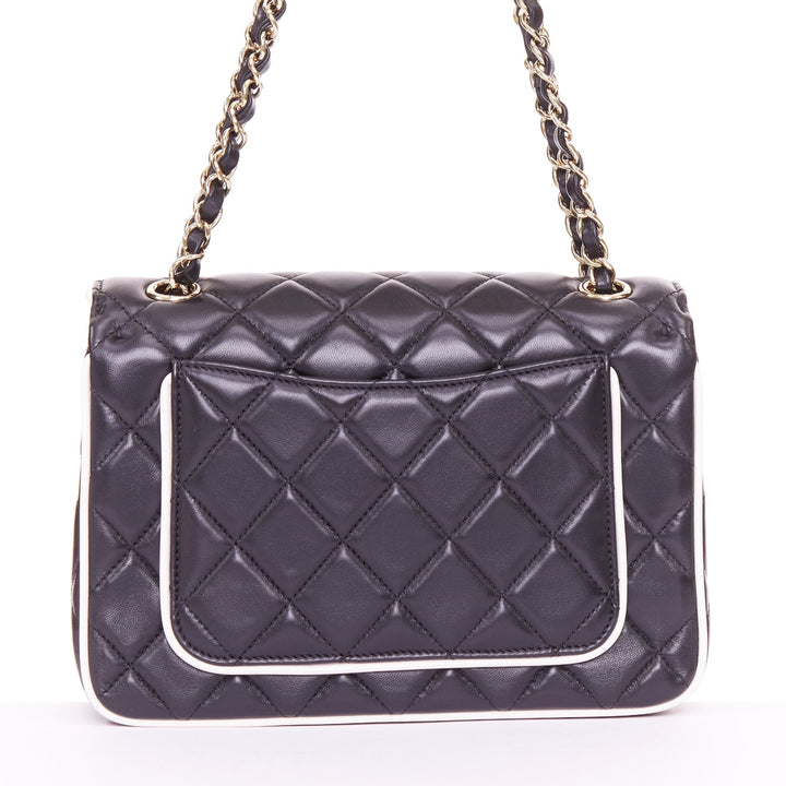 CHANEL 2025 Graphic Frame black quilted lambskin piping mini square flap bag