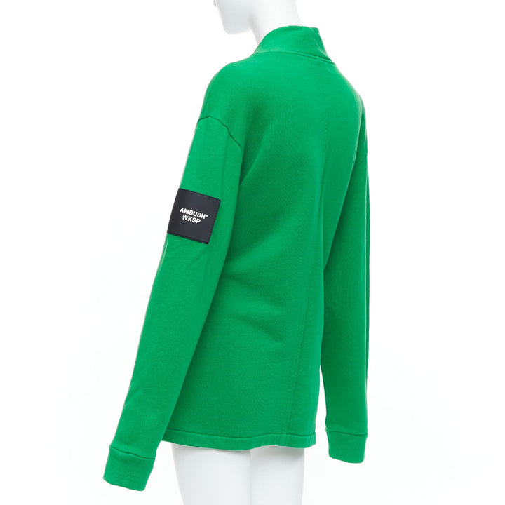 Female mannequin wearing Ambush WKSP Green Cotton Women Coat in Size  S | Available at JHROP