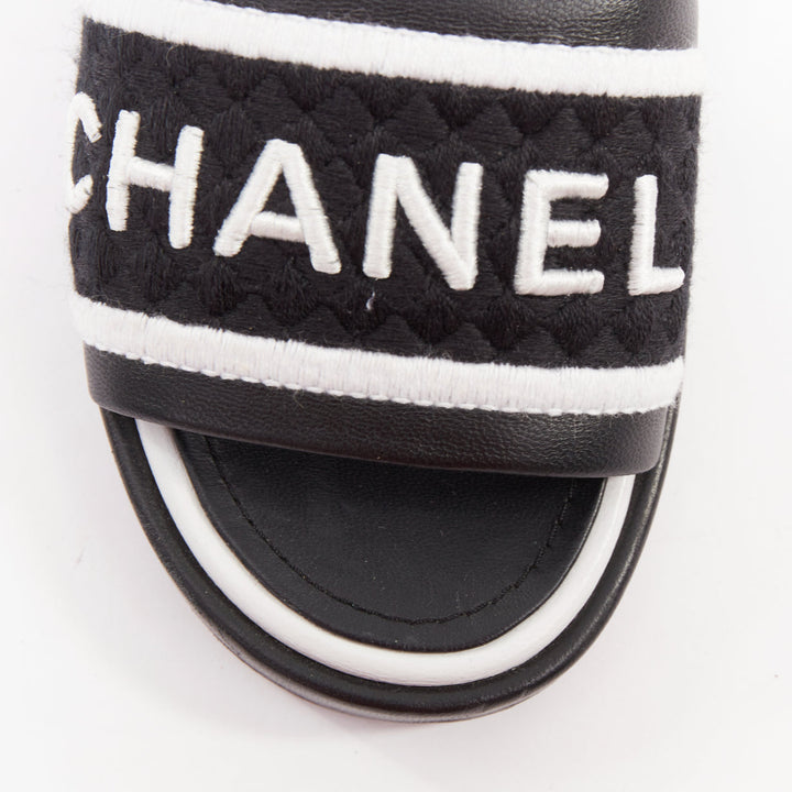 CHANEL 2021 Runway black white logo embroidered lambskin CC mule sandals EU35.5