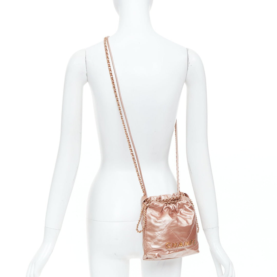 CHANEL 2023 Runway 22 Mini rose gold metallic calfskin leather drawstring bag