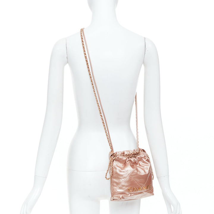 CHANEL 2023 Runway 22 Mini rose gold metallic calfskin leather drawstring bag