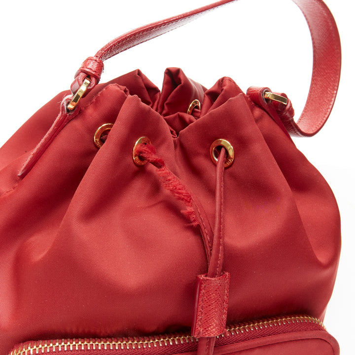 Female mannequin wearing Prada by Miuccia Prada Red Nylon Women Bag in Size  | Available at JHROP