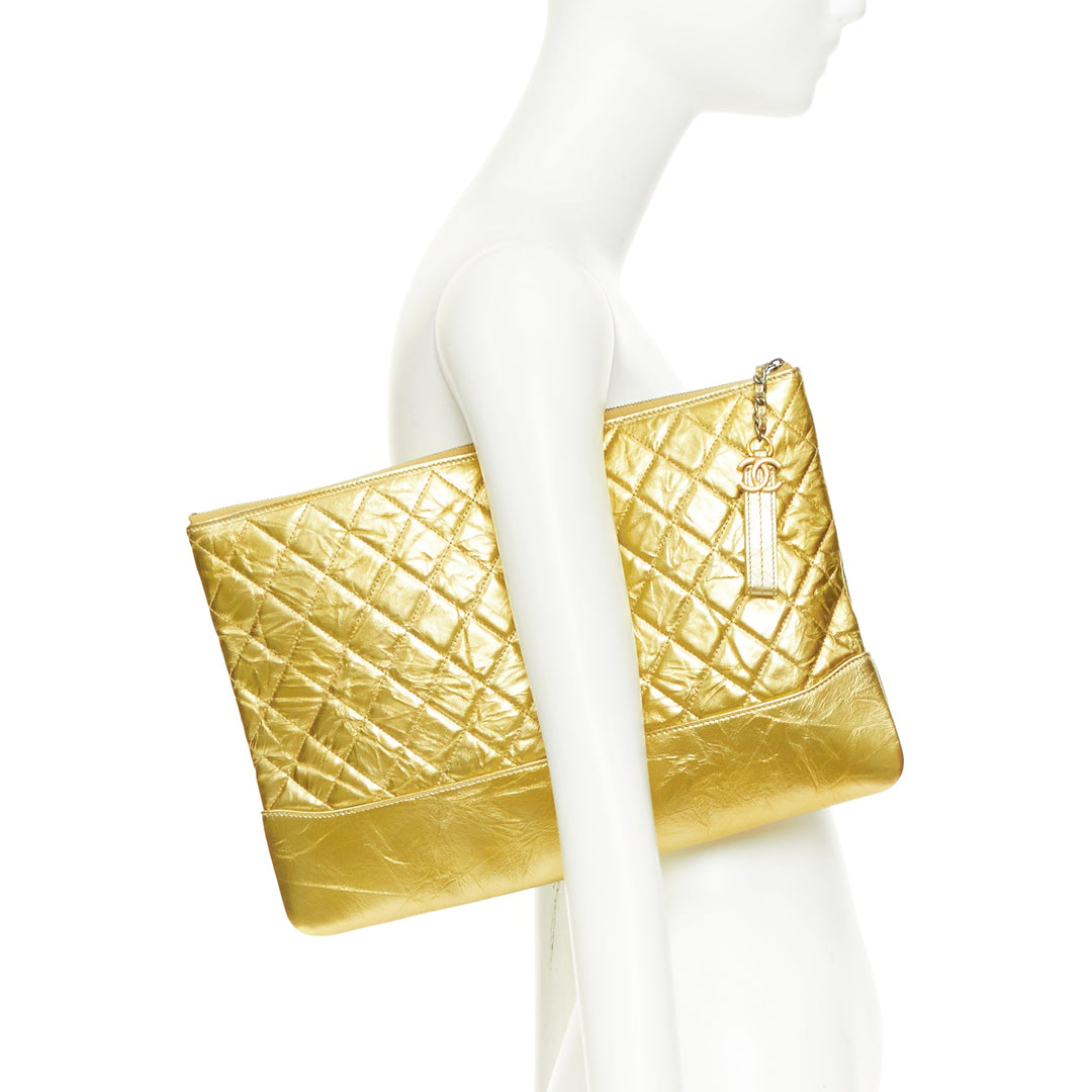 CHANEL Gabrielle O-Case Large gold aged calfskin CC logo quilted clutch bag